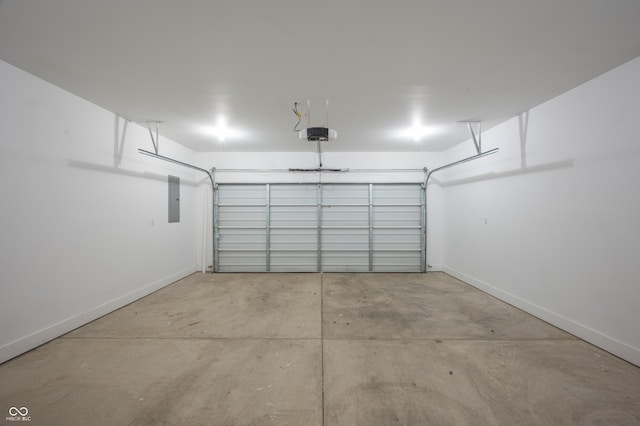 2159 W 58th St NW, Indianapolis, IN 46228 - garage with electric panel and a garage door opener