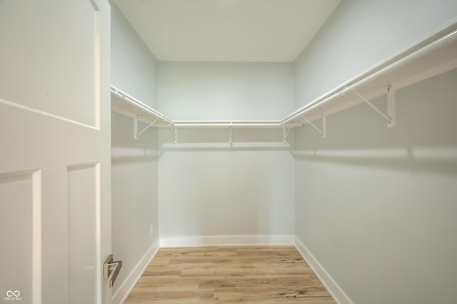 2159 W 58th St NW, Indianapolis, IN 46228 - walk in closet featuring wood finished floors