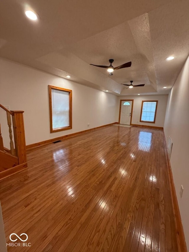 1421 S Meridian St, Indianapolis, IN 46225 - empty room with hardwood / wood-style floors, a textured ceiling, baseboards, a ceiling fan, and recessed lighting