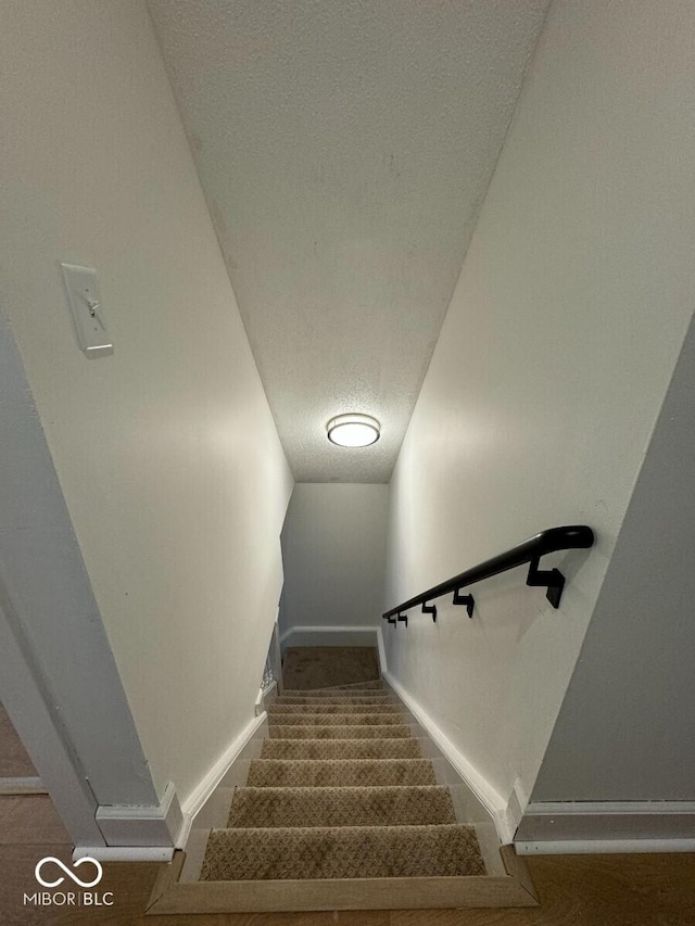 1421 S Meridian St, Indianapolis, IN 46225 - stairway featuring a textured ceiling and baseboards