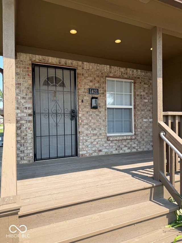 1421 S Meridian St, Indianapolis, IN 46225 - entrance to property with a porch and brick siding