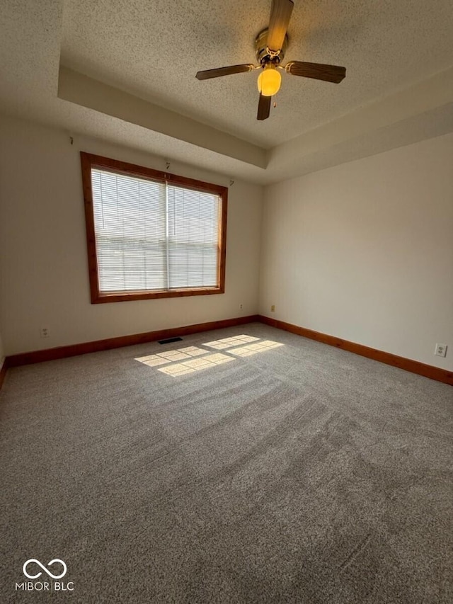 1421 S Meridian St, Indianapolis, IN 46225 - unfurnished room featuring a textured ceiling, baseboards, carpet flooring, and a ceiling fan