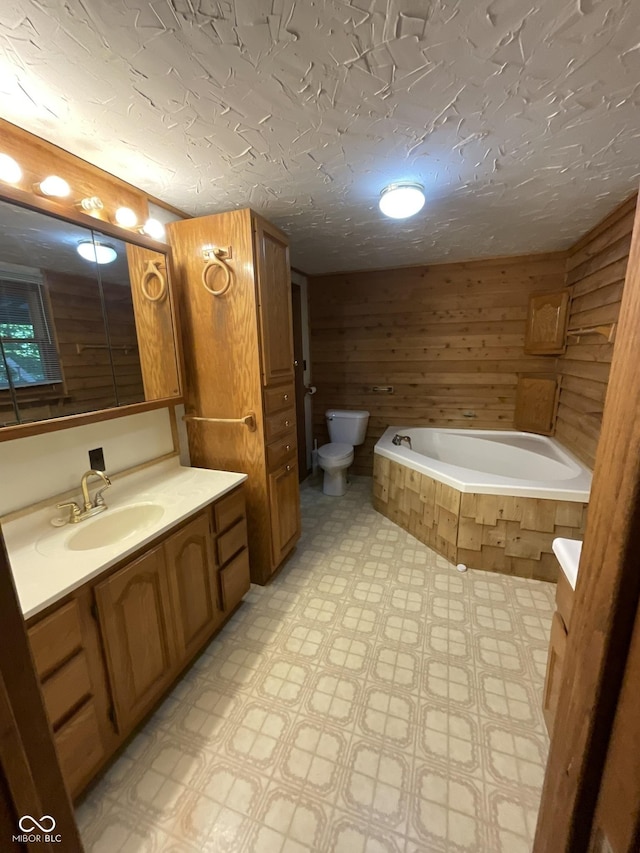 6758 S US Highway 63, Hillsdale, IN 47854 - full bathroom with tile patterned floors, vanity, toilet, a relaxing tiled tub, and wood walls