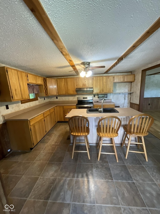 6758 S US Highway 63, Hillsdale, IN 47854 - kitchen with a sink, electric range, a textured ceiling, under cabinet range hood, and ceiling fan