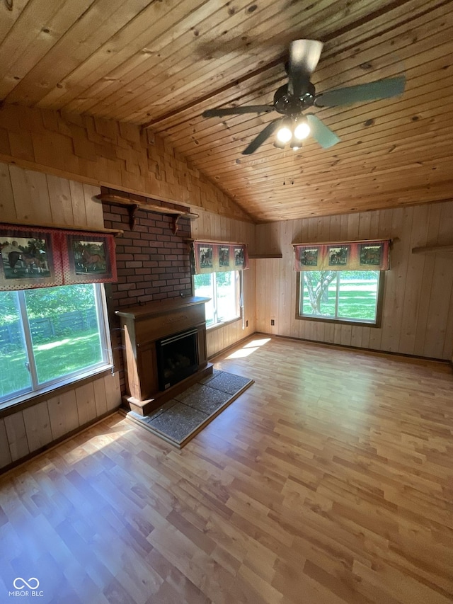 6758 S US Highway 63, Hillsdale, IN 47854 - unfurnished living room featuring wooden ceiling, vaulted ceiling, wood finished floors, wood walls, and a ceiling fan