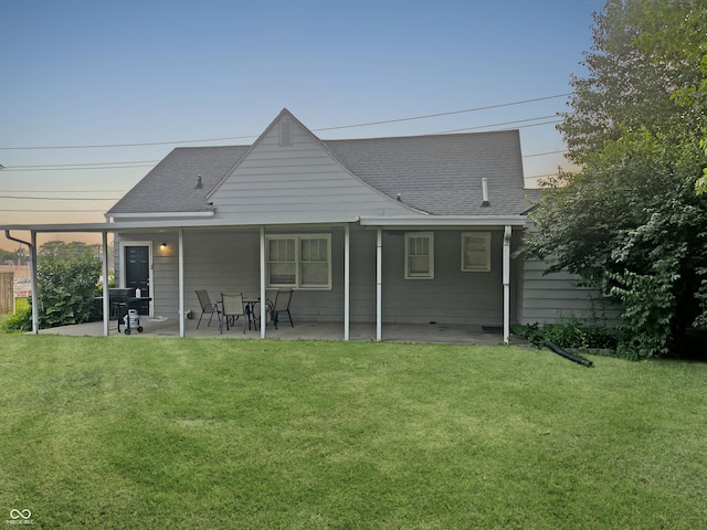 1141 N Shadeland Ave, Indianapolis, IN 46219 - back of house with a patio area, a yard, and roof with shingles