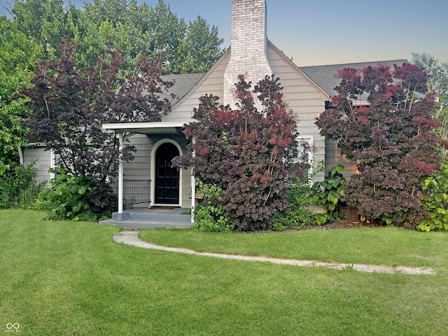 1141 N Shadeland Ave, Indianapolis, IN 46219 - view of front facade featuring a chimney and a front yard