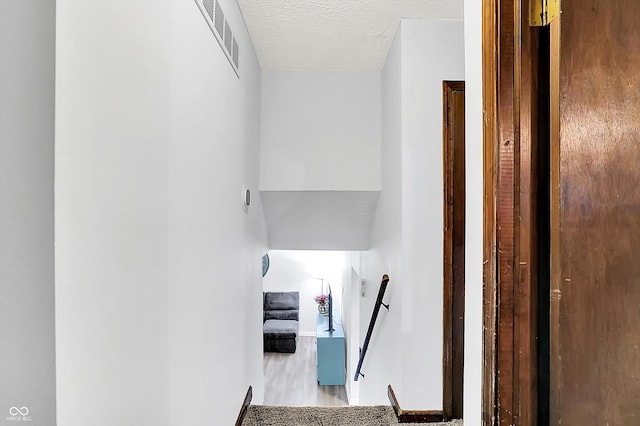 7504 Troon Ct, Indianapolis, IN 46237 - staircase with wood finished floors and a textured ceiling