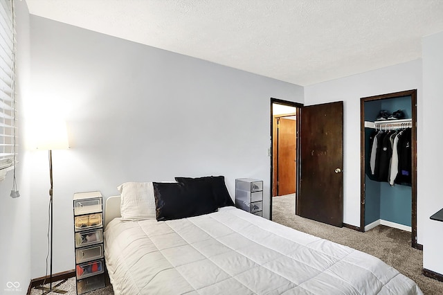 7504 Troon Ct, Indianapolis, IN 46237 - bedroom featuring carpet flooring, baseboards, a textured ceiling, and a closet
