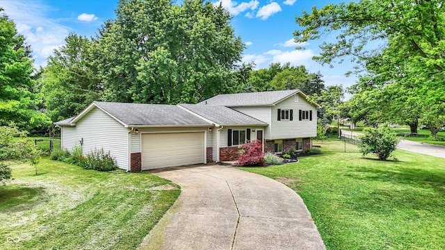 7504 Troon Ct, Indianapolis, IN 46237 - split level home featuring an attached garage, roof with shingles, concrete driveway, and brick siding