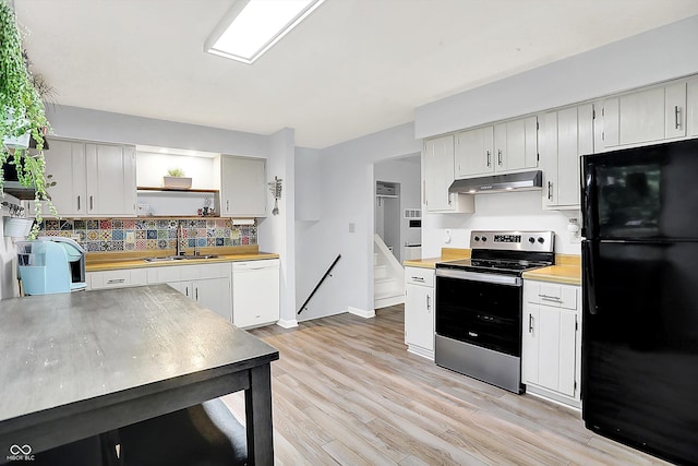 7504 Troon Ct, Indianapolis, IN 46237 - kitchen featuring freestanding refrigerator, stainless steel range with electric stovetop, white dishwasher, a sink, and under cabinet range hood