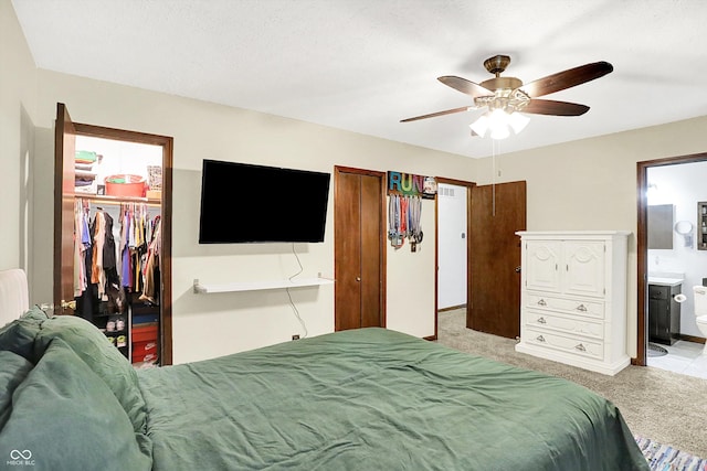 7504 Troon Ct, Indianapolis, IN 46237 - bedroom with light colored carpet, a spacious closet, a closet, ensuite bath, and ceiling fan