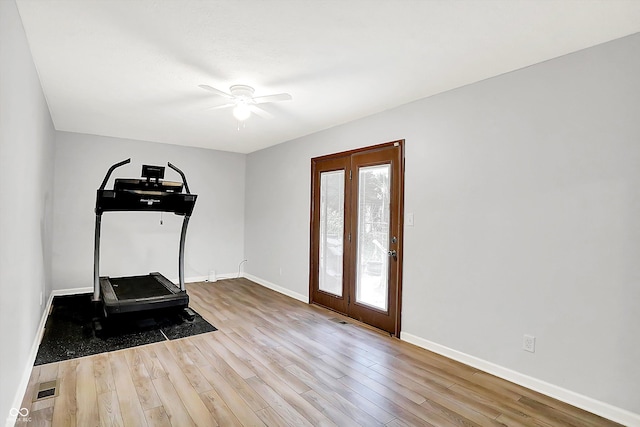 7504 Troon Ct, Indianapolis, IN 46237 - workout area with ceiling fan, wood finished floors, and baseboards