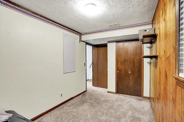 7504 Troon Ct, Indianapolis, IN 46237 - unfurnished bedroom featuring a textured ceiling, carpet floors, and baseboards