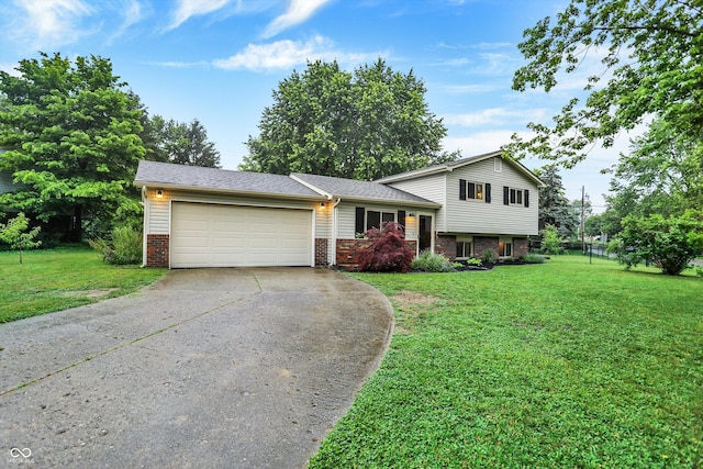 7504 Troon Ct, Indianapolis, IN 46237 - tri-level home featuring concrete driveway, brick siding, an attached garage, and a front lawn