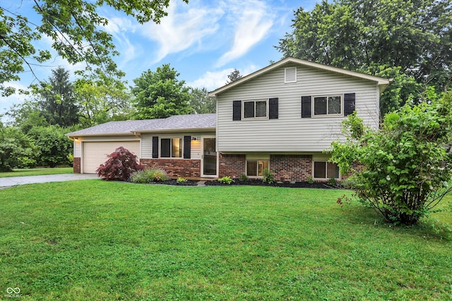 7504 Troon Ct, Indianapolis, IN 46237 - split level home featuring an attached garage, driveway, a front lawn, and brick siding