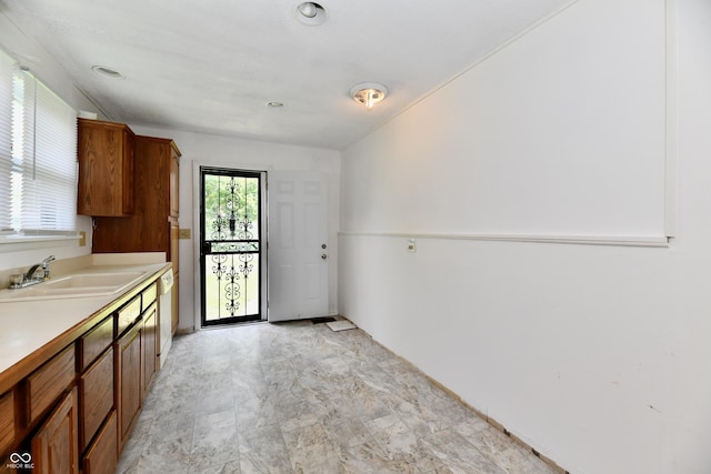 1346 W 27th St, Indianapolis, IN 46208 - kitchen featuring brown cabinets, light countertops, a sink, and white dishwasher