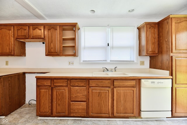 1346 W 27th St, Indianapolis, IN 46208 - kitchen with dishwasher, a sink, and brown cabinets
