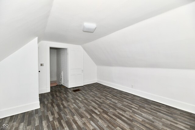 1346 W 27th St, Indianapolis, IN 46208 - bonus room featuring baseboards, dark wood-type flooring, and lofted ceiling
