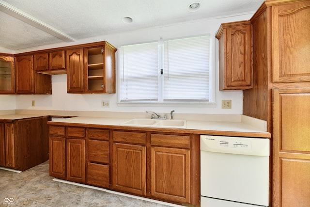 1346 W 27th St, Indianapolis, IN 46208 - kitchen featuring dishwasher, a sink, brown cabinets, and a textured ceiling