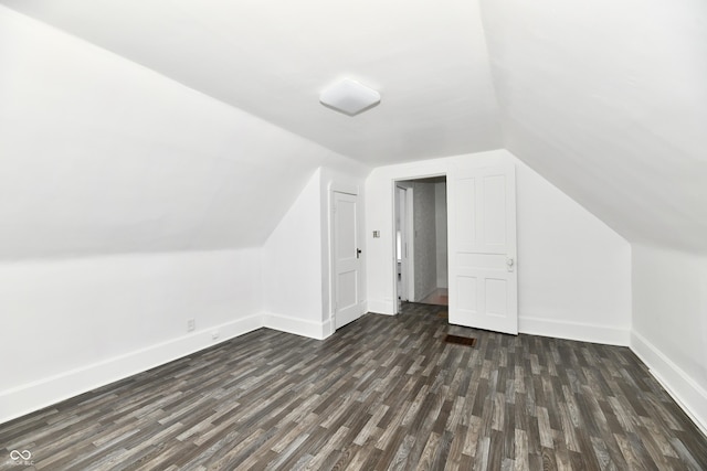 1346 W 27th St, Indianapolis, IN 46208 - bonus room with dark wood-style floors, baseboards, and lofted ceiling