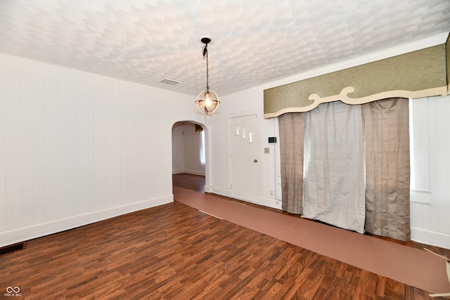 1346 W 27th St, Indianapolis, IN 46208 - spare room with arched walkways, wood finished floors, and baseboards