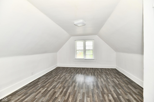 1346 W 27th St, Indianapolis, IN 46208 - bonus room with baseboards, dark wood-type flooring, and lofted ceiling