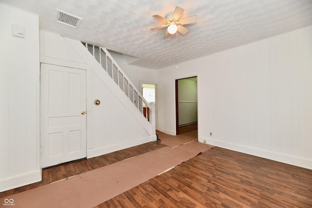 1346 W 27th St, Indianapolis, IN 46208 - unfurnished room with stairs, wood finished floors, a ceiling fan, and baseboards