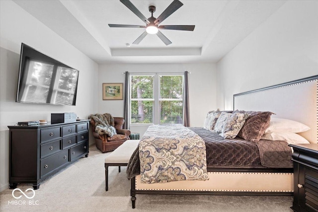 7154 Covington St, Lebanon, IN 46052 - bedroom with light carpet, a tray ceiling, and ceiling fan