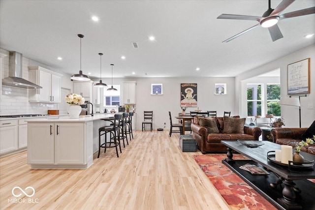 7154 Covington St, Lebanon, IN 46052 - living area with light wood-type flooring, ceiling fan, and recessed lighting