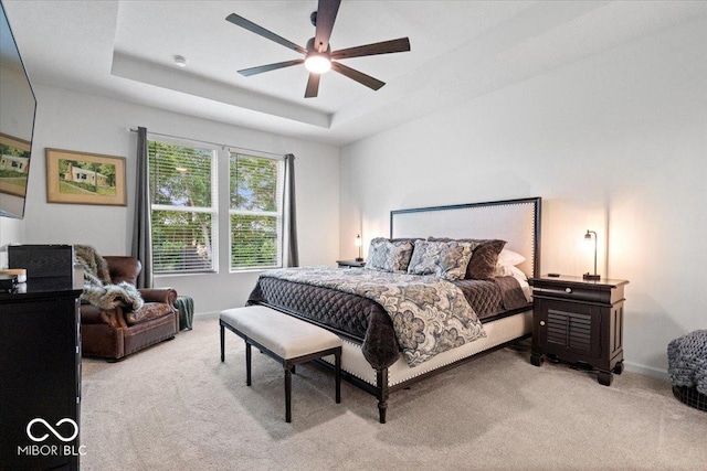 7154 Covington St, Lebanon, IN 46052 - carpeted bedroom with a raised ceiling, baseboards, and a ceiling fan