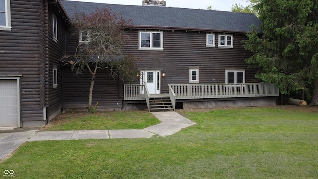 2858 N Stout Rd, Liberty, IN 47353 - back of house featuring log exterior, a deck, a yard, a chimney, and a shingled roof