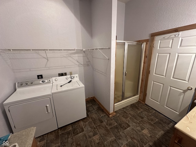 2858 N Stout Rd, Liberty, IN 47353 - washroom with washing machine and clothes dryer and a textured wall