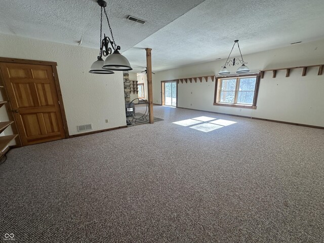 2858 N Stout Rd, Liberty, IN 47353 - unfurnished living room with carpet floors, baseboards, a textured ceiling, and a textured wall