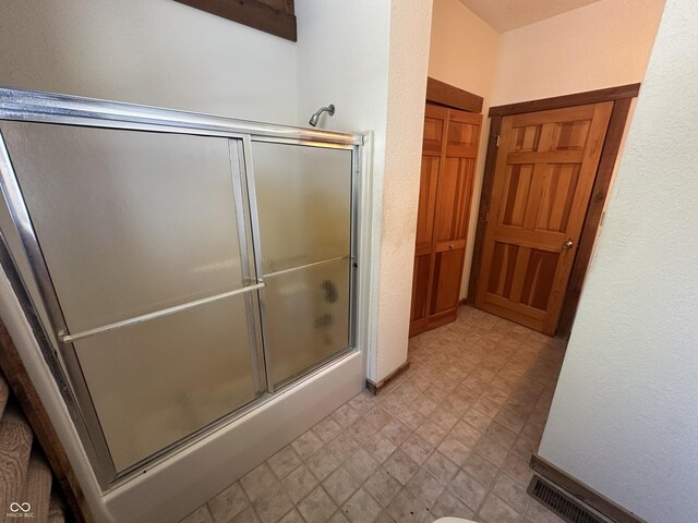 2858 N Stout Rd, Liberty, IN 47353 - bathroom featuring combined bath / shower with glass door