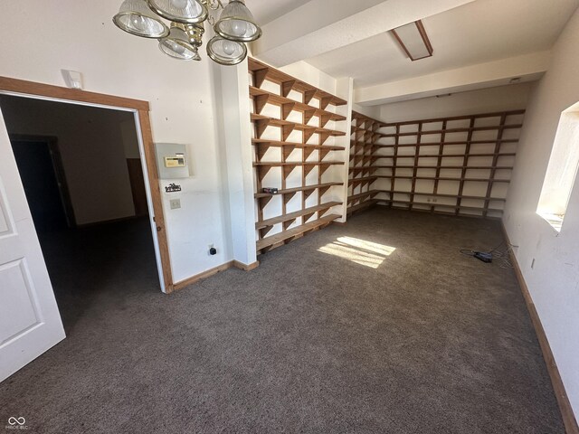 2858 N Stout Rd, Liberty, IN 47353 - spare room featuring carpet floors and a chandelier