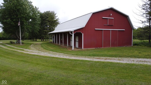 2858 N Stout Rd, Liberty, IN 47353 - view of barn featuring driveway and a yard