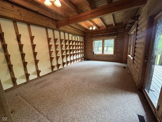 2858 N Stout Rd, Liberty, IN 47353 - unfurnished room with log walls, wood ceiling with exposed beams, and carpet floors
