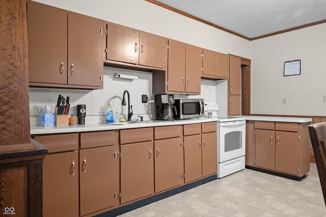 11780 S Hoover St, Clinton, IN 47842 - kitchen with white electric stove, a sink, stainless steel microwave, light countertops, and crown molding