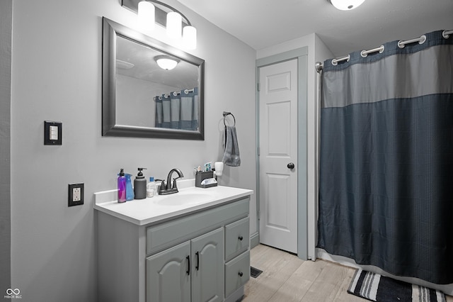 11780 S Hoover St, Clinton, IN 47842 - full bathroom featuring vanity, wood finished floors, and curtained shower