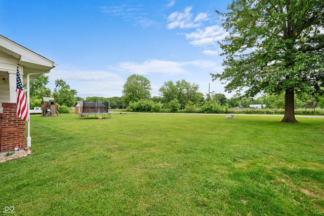 11780 S Hoover St, Clinton, IN 47842 - view of green lawn with a trampoline and a playground