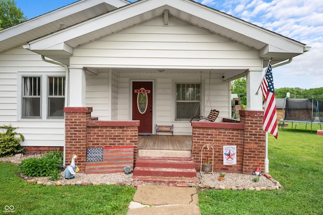 11780 S Hoover St, Clinton, IN 47842 - bungalow-style home featuring a trampoline, covered porch, and a front yard