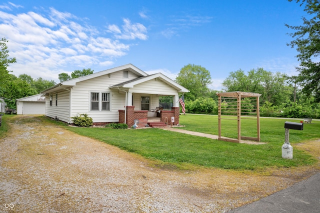 11780 S Hoover St, Clinton, IN 47842 - view of front of home featuring covered porch, a front lawn, and a detached garage