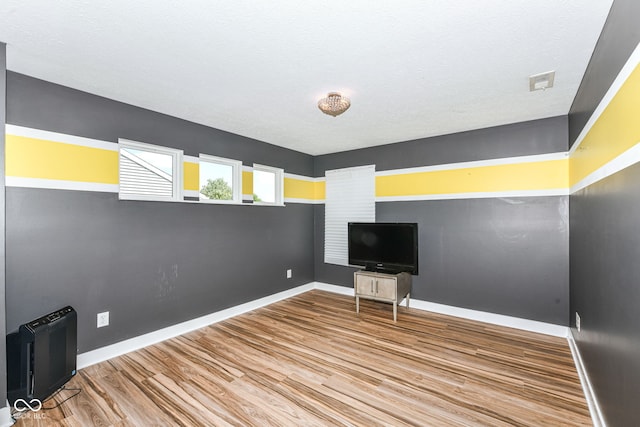 1217 Old Vines Trl, Greenwood, IN 46143 - spare room with wood finished floors and baseboards