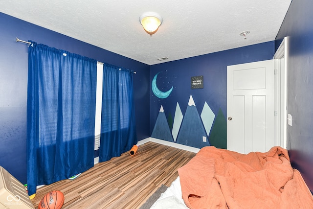 1217 Old Vines Trl, Greenwood, IN 46143 - bedroom with wood finished floors and a textured ceiling