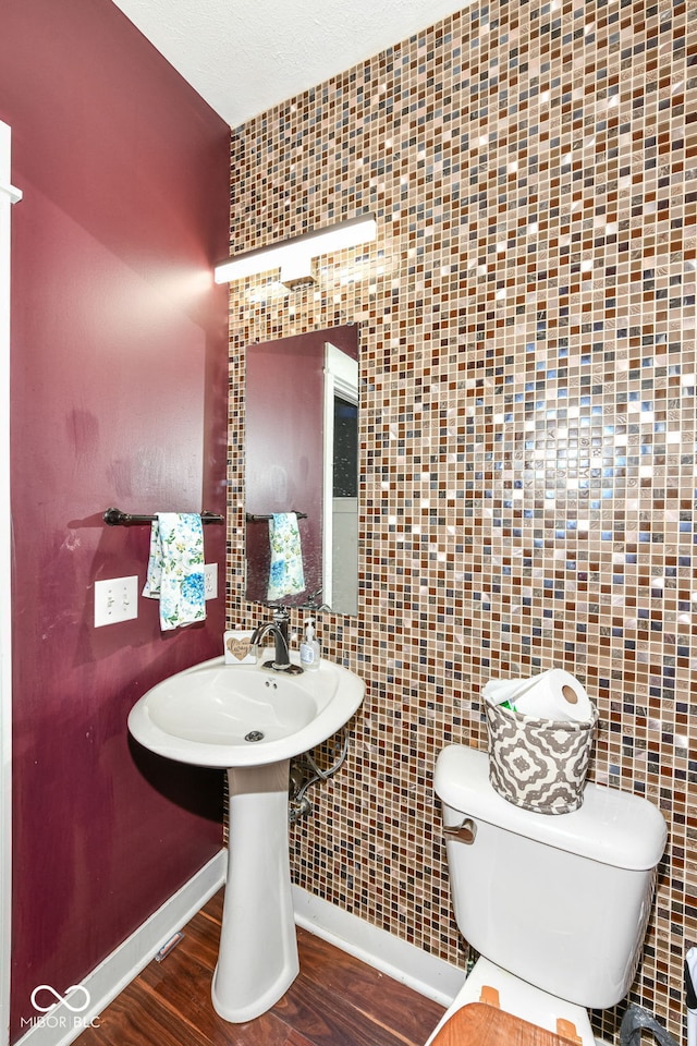 1217 Old Vines Trl, Greenwood, IN 46143 - half bathroom with toilet and wood finished floors