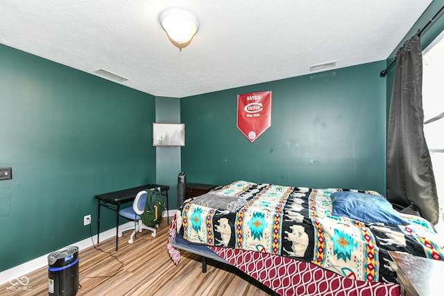 1217 Old Vines Trl, Greenwood, IN 46143 - bedroom with wood finished floors and a textured ceiling