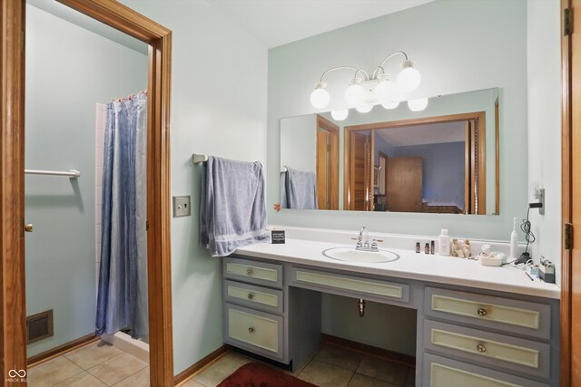 1914 S Avon Ave, Avon, IN 46123 - bathroom featuring vanity, tile patterned floors, a stall shower, and baseboards