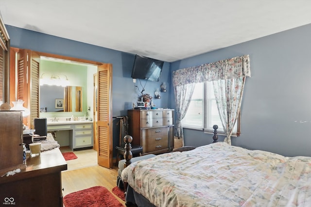 1914 S Avon Ave, Avon, IN 46123 - bedroom with an office area, light wood finished floors, and connected bathroom