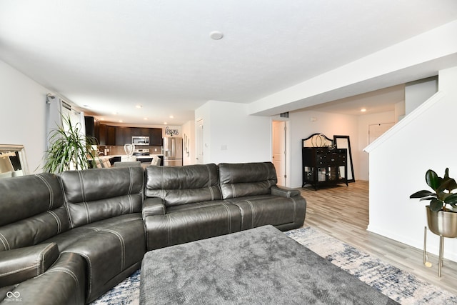 6883 Honeysuckle Way, Pendleton, IN 46064 - living room with light wood-style floors and recessed lighting
